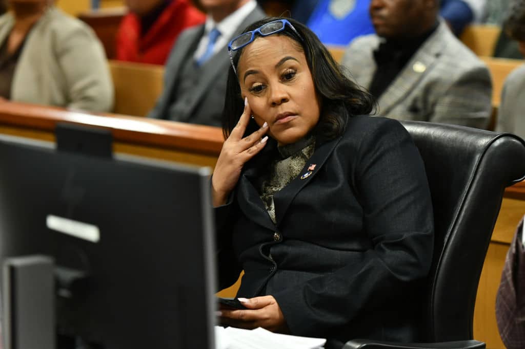 ATLANTA, GEORGIA - NOVEMBER 21: Fulton County District Attorney Fani Willis appears before Judge Scott McAfee for a hearing in the 2020 Georgia election interference case at the Fulton County Courthouse on November 21, 2023 in Atlanta, Georgia. Judge McAfee heard arguments as to whether co-defendant Harrison Floyd should be sent to jail for social media posts and comments that potentially targeted witnesses in the trial. McAfee declined to revoke Floyd's bond. Floyd was charged along with former US President Donald Trump and 17 others in an indictment that accuses them of illegally conspiring to subvert the will of Georgia voters in the 2020 presidential election.